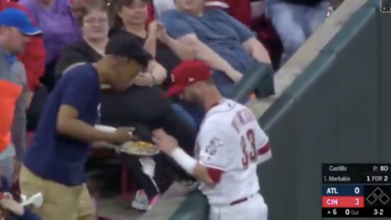 Baseball Player Distracted By Fan's Nachos After Catching Ball Mid-Game