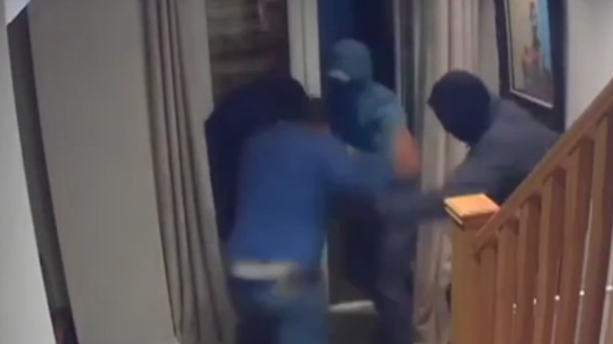 Businessman Fights Off Four Armed Robbers With His Bare Hands In Surreal Security Video