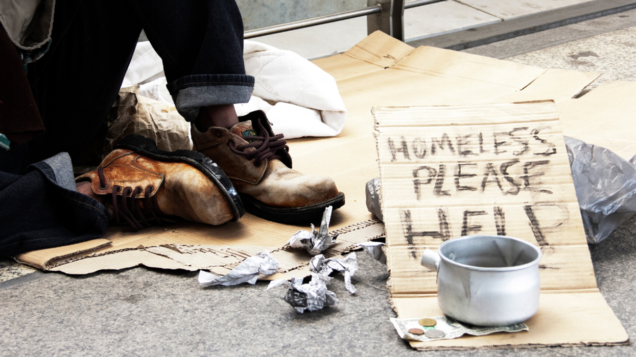 Alabama Cops Apologize After Backlash For Posing With 'Homeless Quilt' Made Out Of Signs They Took From Homeless People