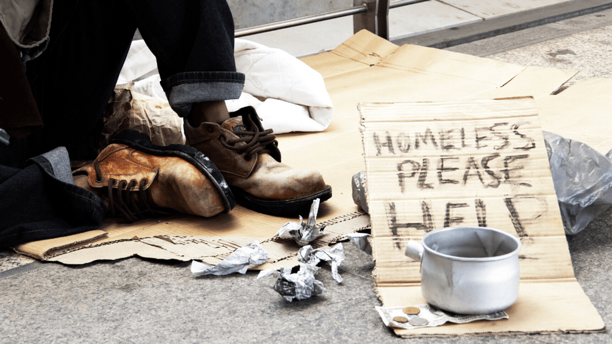 Alabama Cops Apologize After Backlash For Posing With 'Homeless Quilt' Made Out Of Signs They Took From Homeless People