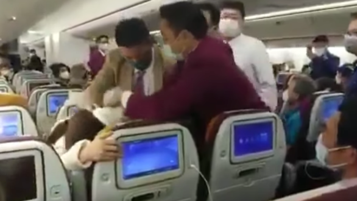 Crew Tackles Chinese Woman After She Freaked Out About Being Delayed And 'Deliberately' Coughed On A Flight Attendant To Spark Panic