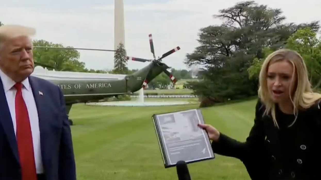 Trump's Press Secretary Just Claimed Trump Had a Better Pandemic Plan Than Obama and She Had Binders to Prove It