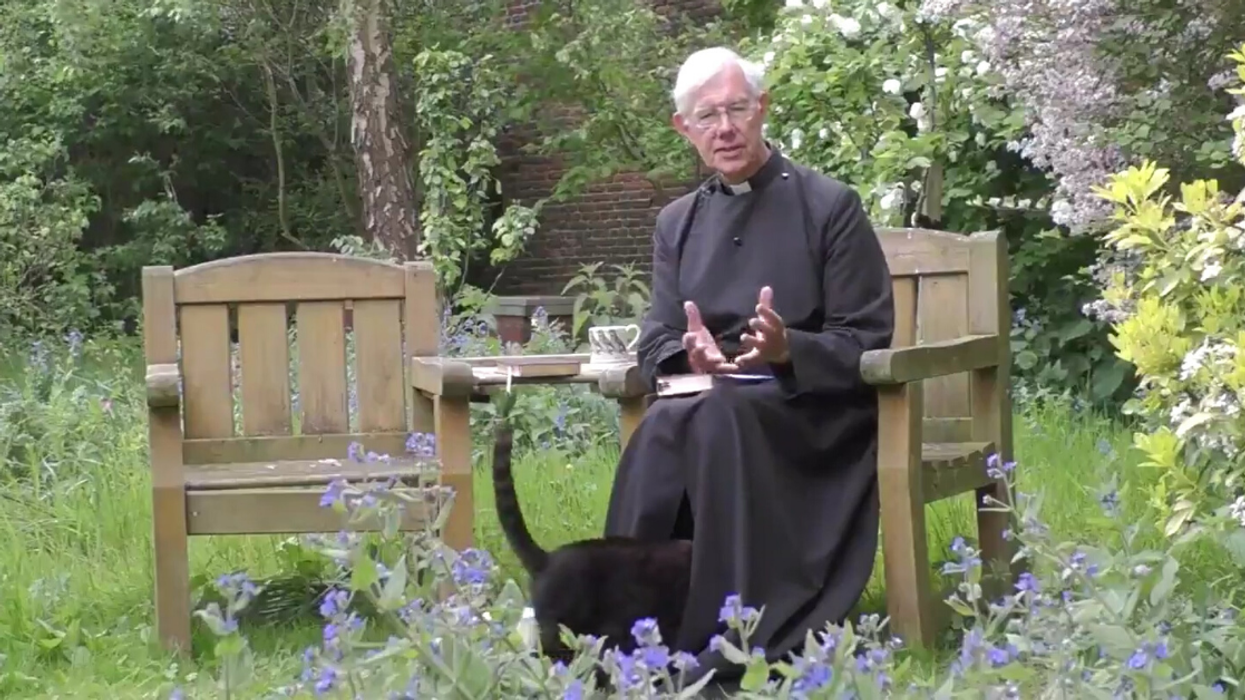 Cat Goes Viral After Disappearing Underneath Clergyman's Robes During Video Sermon
