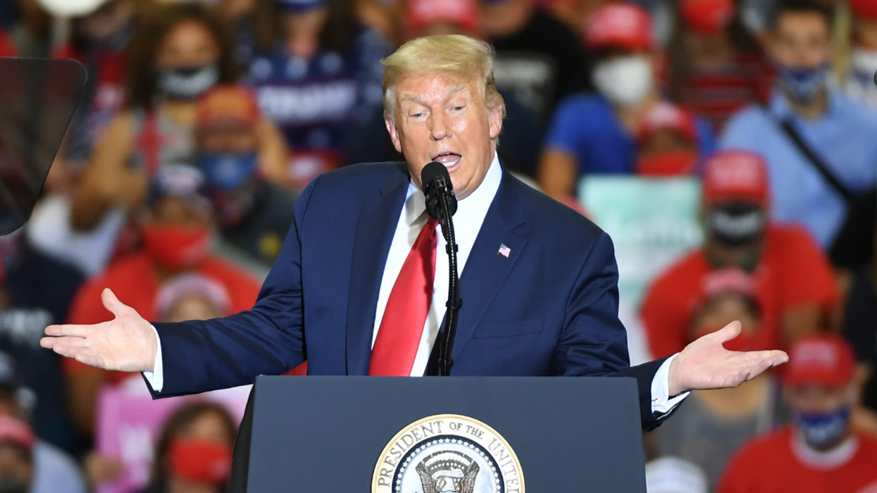 Photographer Calls Out Trump After He Tried To Pass Off A 4-Year-Old Photo Of Trump Yard Signs As New