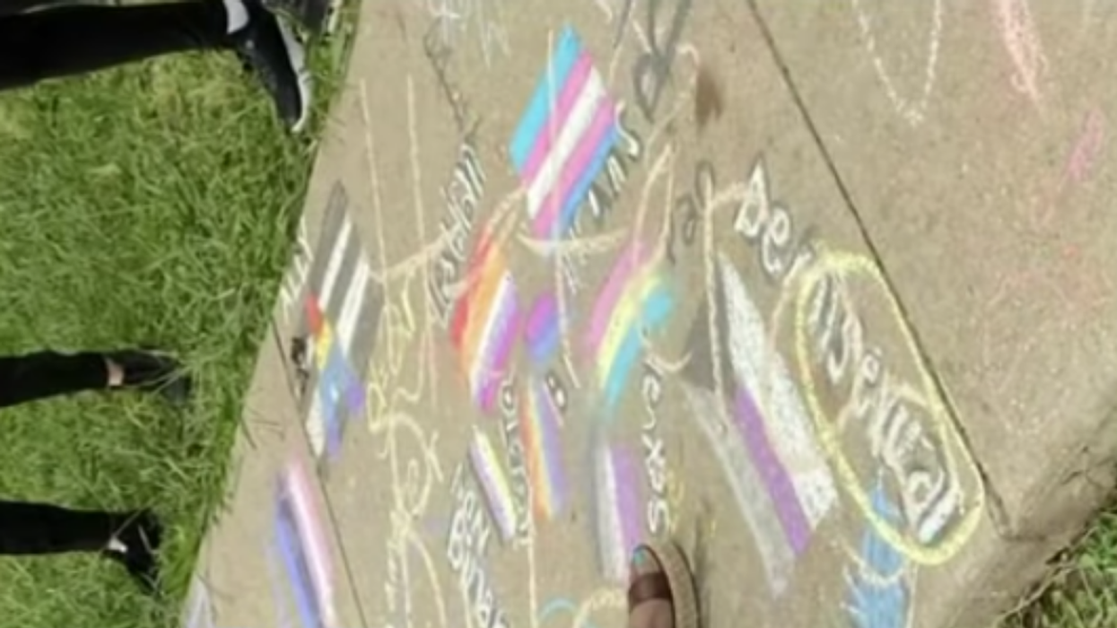 Students Outraged After Teacher Is Filmed Scrawling 'Heteros Rule' Over Their LGBTQ+ Pride Chalk Art