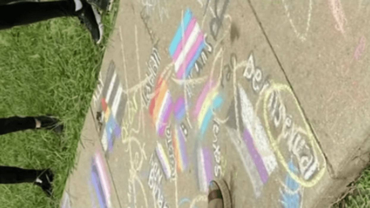 Students Outraged After Teacher Is Filmed Scrawling 'Heteros Rule' Over Their LGBTQ+ Pride Chalk Art