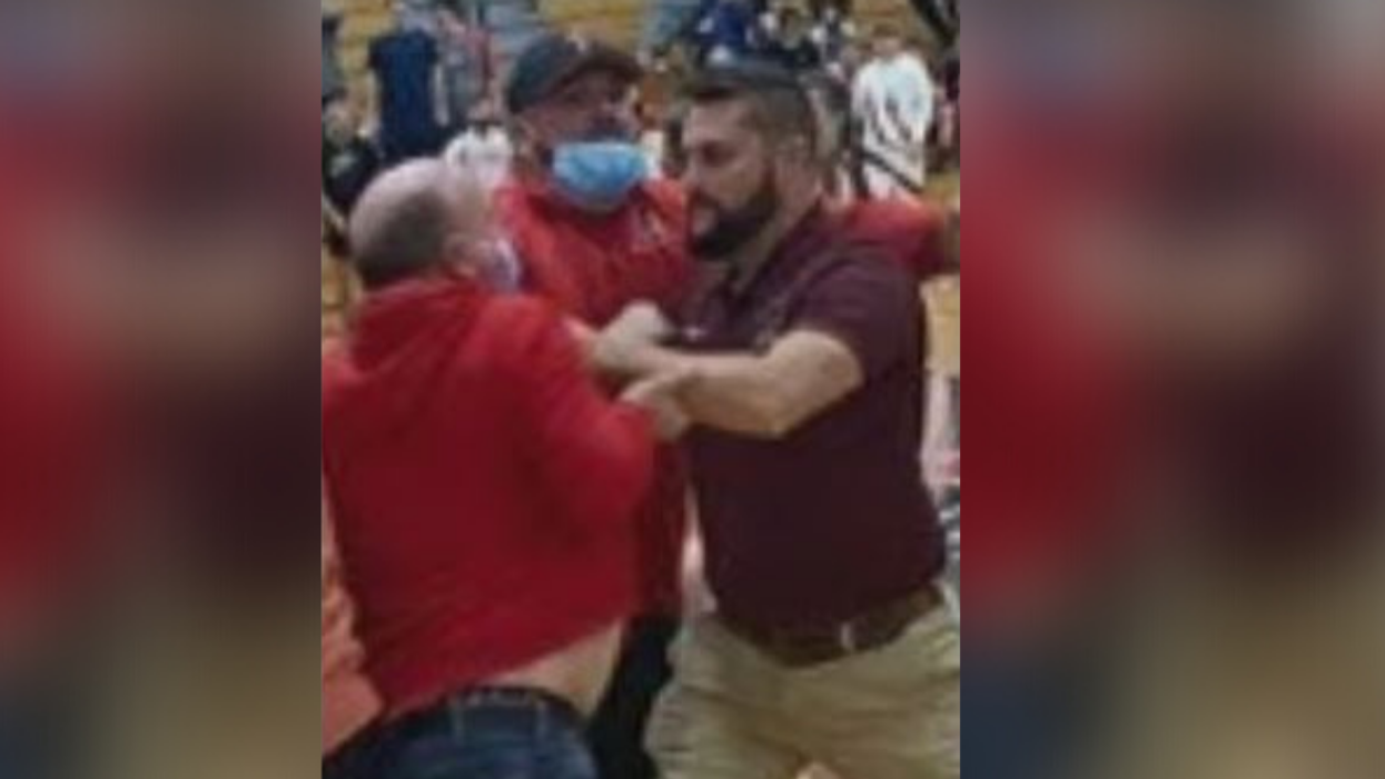 Kentucky Sheriff Wanted For Assault After Video Shows Him Punching Teen Girl In Face During High School Basketball Brawl