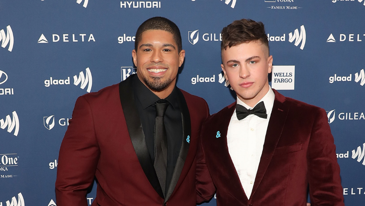 Openly-Gay Pro Wrestler Defiantly Kisses Boyfriend In Front Of Homophobic Protesters In Epic Photo