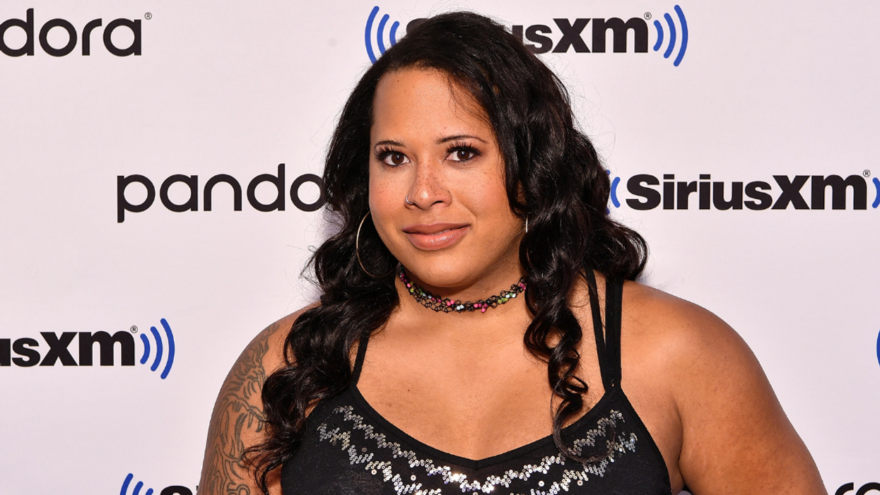 Trans Wrestler's Wife Rips Fan Who Held Up Transphobic Sign And Commentator Who Defended Him