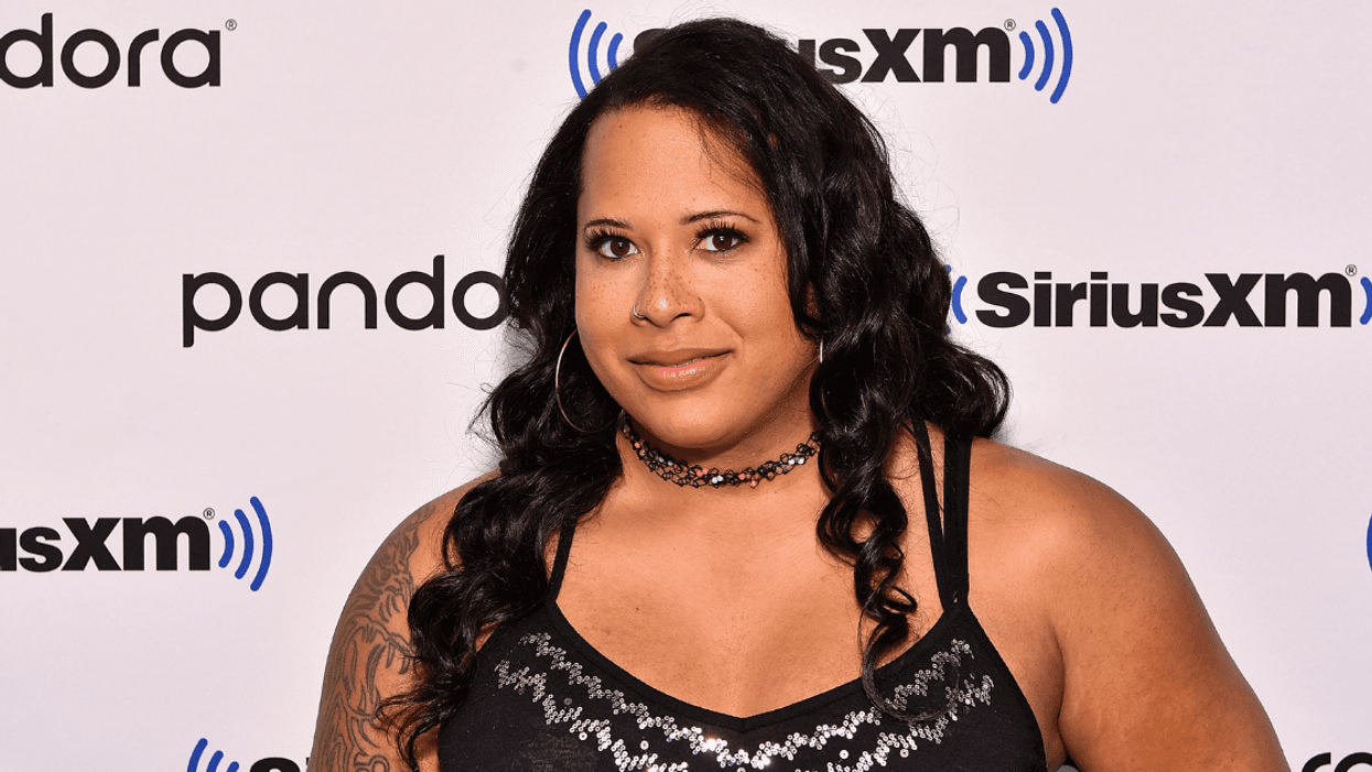 Trans Wrestler's Wife Rips Fan Who Held Up Transphobic Sign And Commentator Who Defended Him