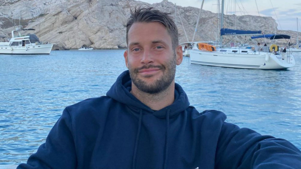 Fashion Designer Claps Back After Homophobic Troll Shames Him For Kissing Husband On Instagram