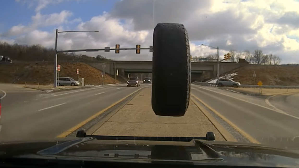 Police Cruiser's Dashcam Captures Harrowing Moment A Runaway Tire Crashes Into Windshield