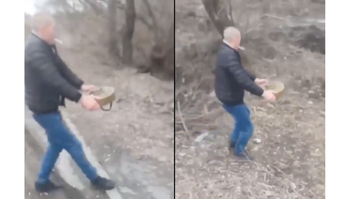 Fearless Ukrainian Man Removes Land Mine From Road With His Bare Hands In Surreal Video