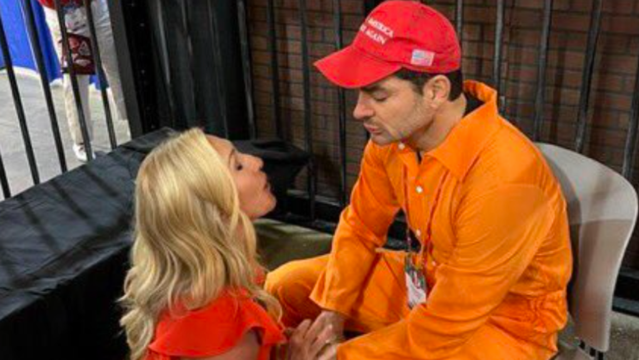 MTG Cries And Prays With Jan. 6 Rioter On Display In A Cage At CPAC In Bizarre Spectacle