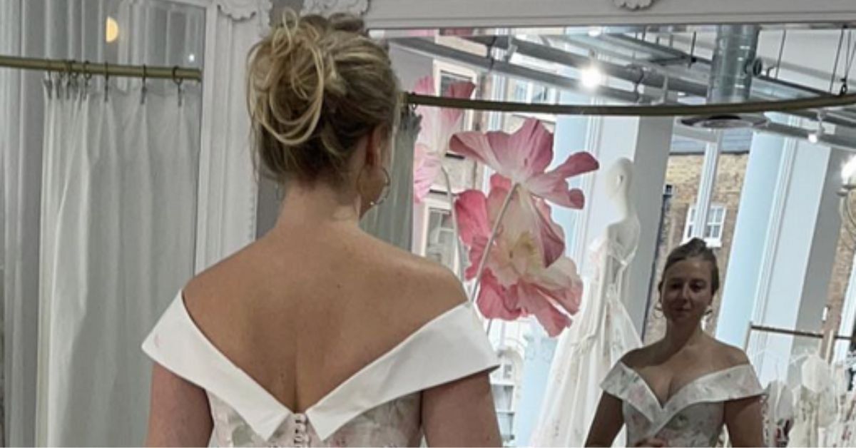 Instagrammer @wheatpraylove in a wedding gown looking in a mirror