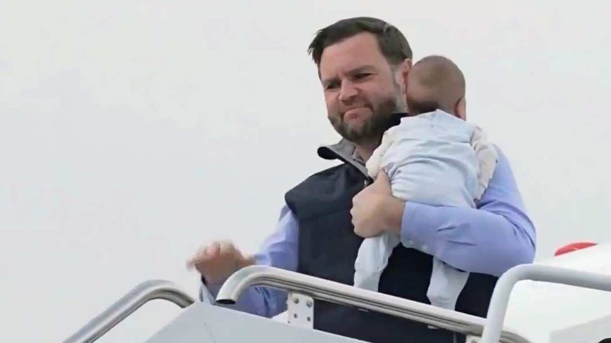 JD Vance carrying his child