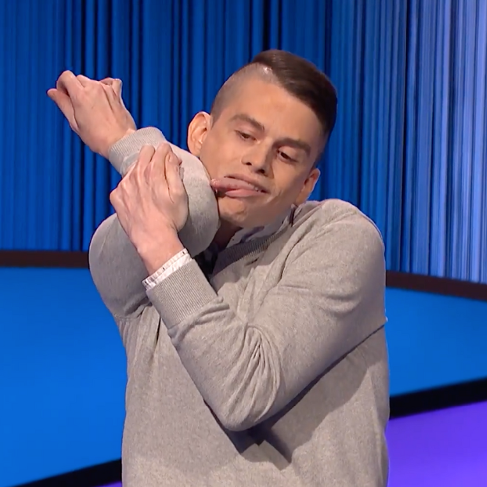 Jeopardy! contestant Andrew Knowles licking his elbow