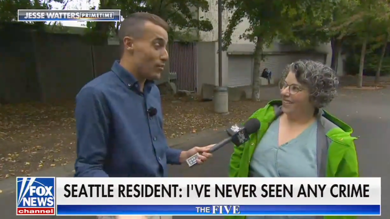 Johnny Belisario speaking with Seattle resident