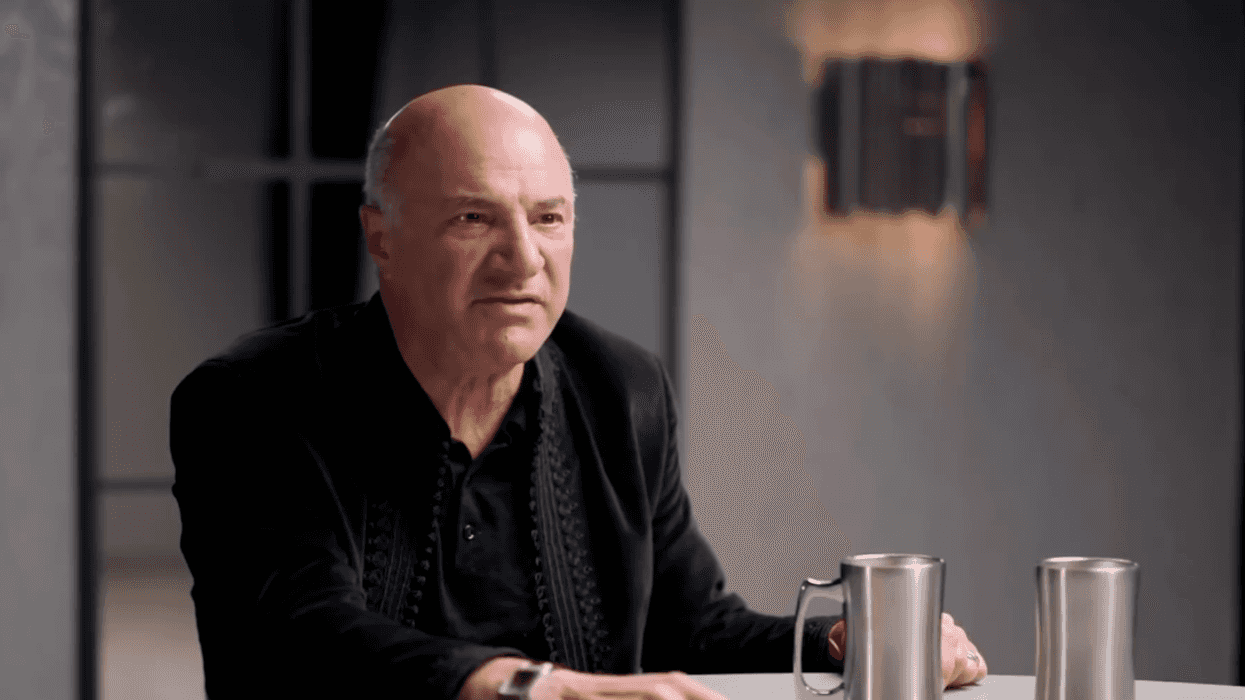 Kevin O'Leary sitting at a table with a focused expression on his face.