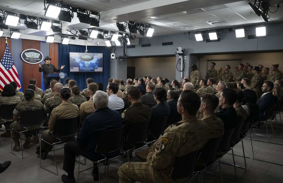 Kid Rock speaking to soldiers