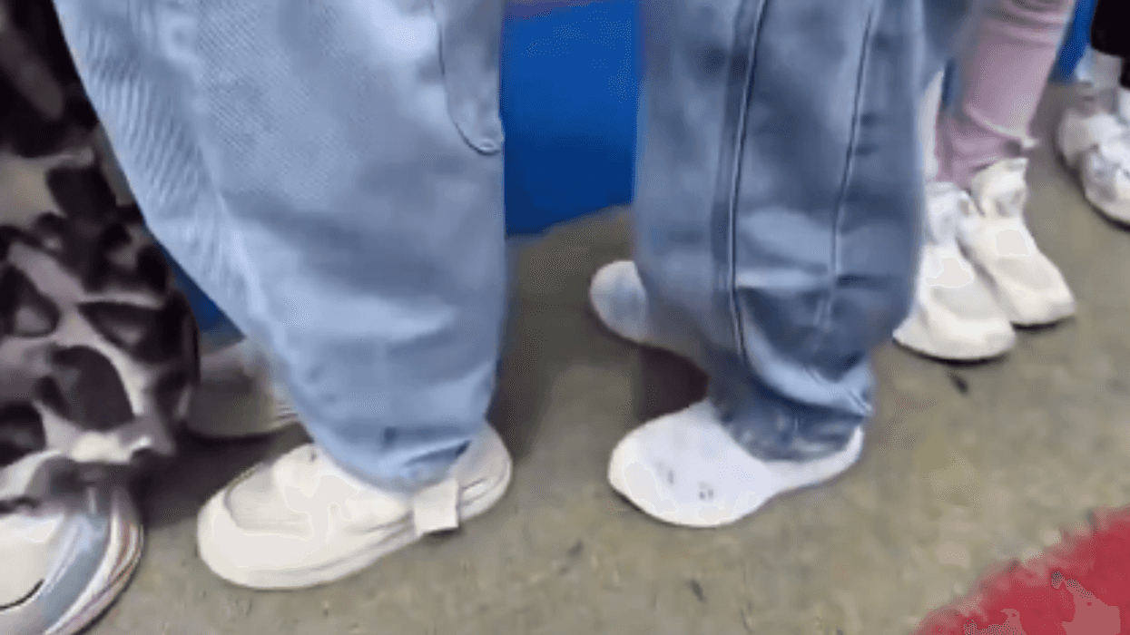 Kids lined up in white shoes