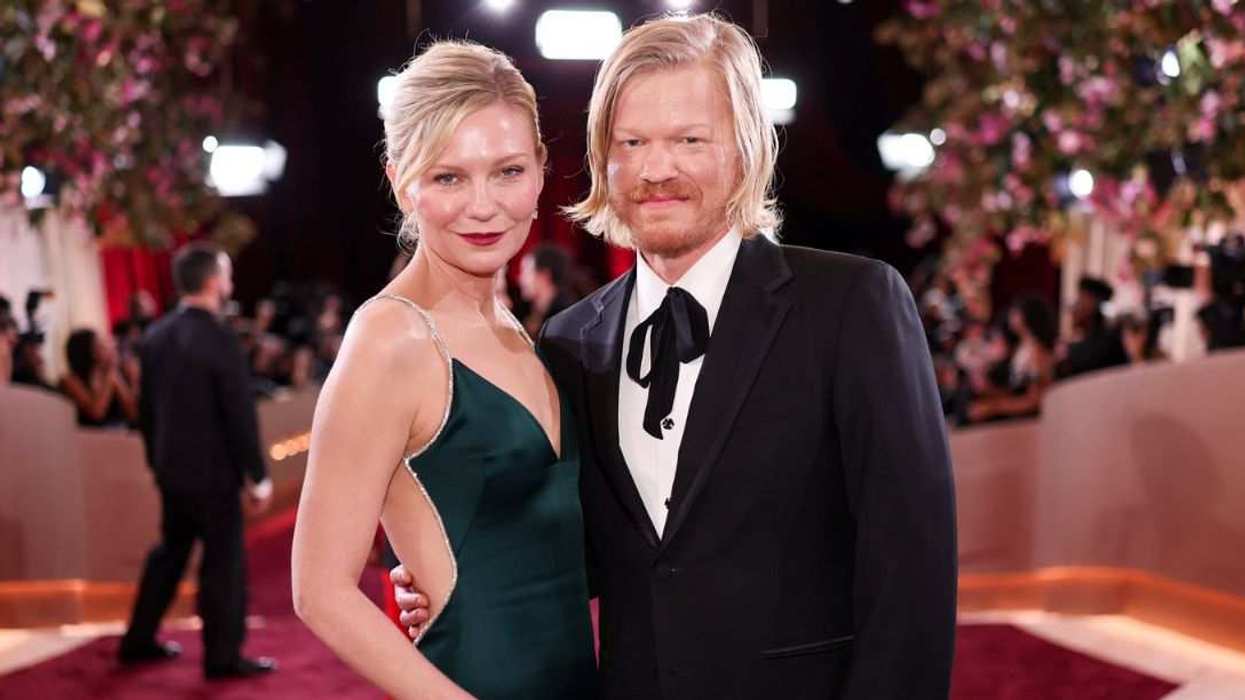 Kirsten Dunst and Jesse Plemons attend the Golden Globe Awards together, posing on the red carpet ahead of the ceremony.