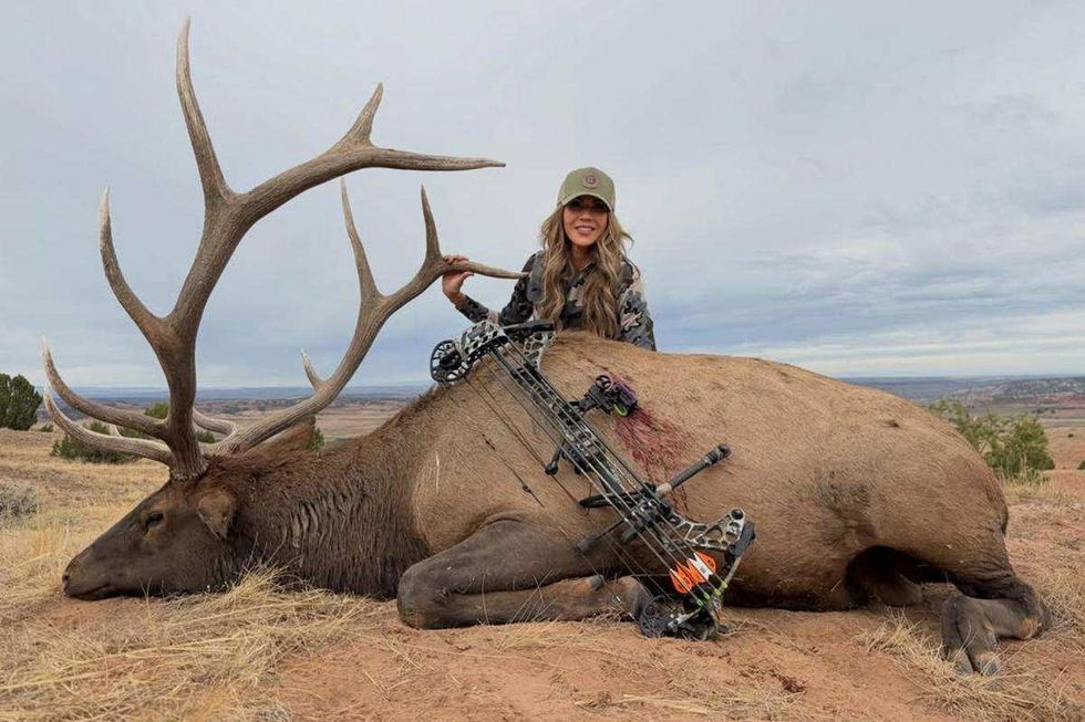Kristi Noem with dead elk