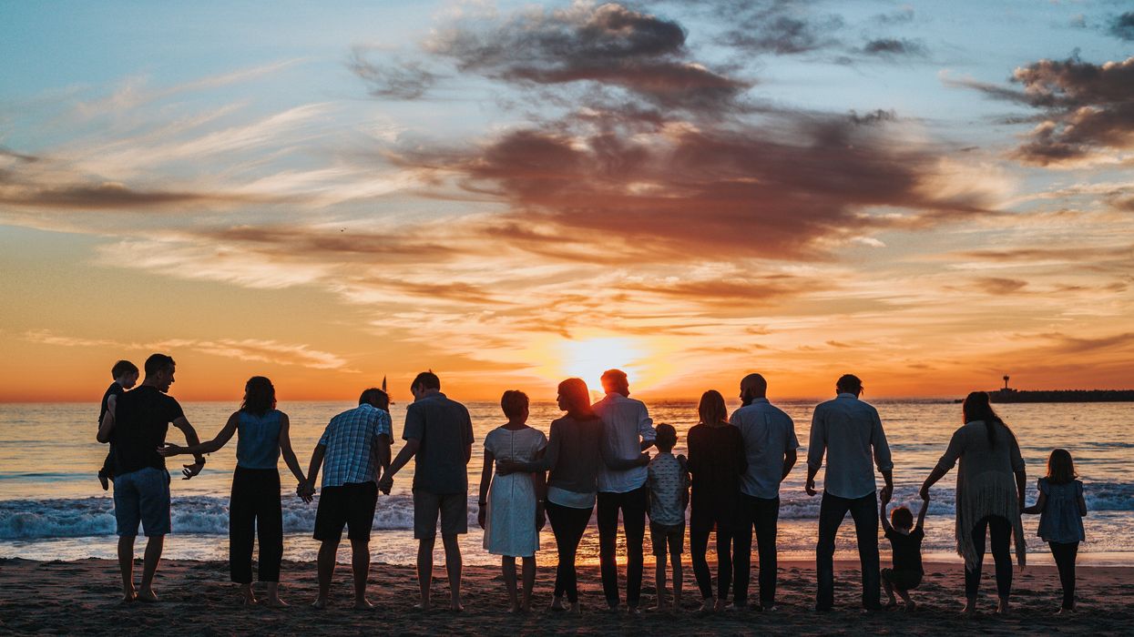 Large family spending time together on beach