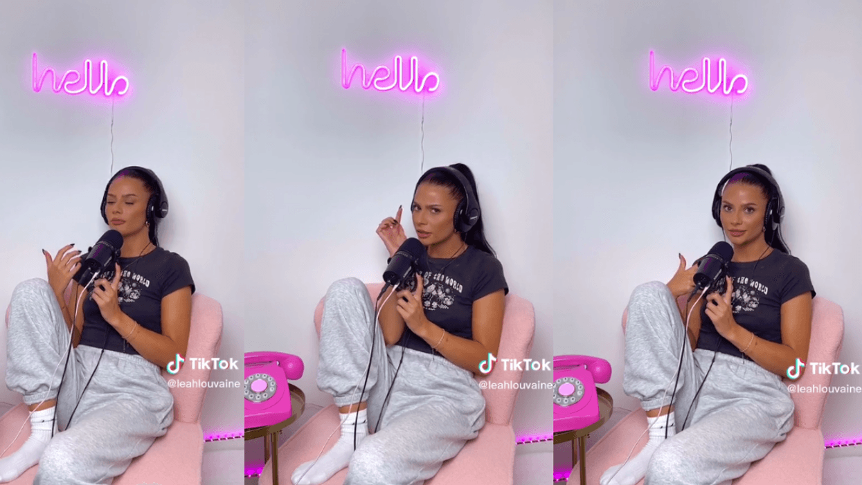 Leah Louvaine sitting in a chair with headphones and a microphone