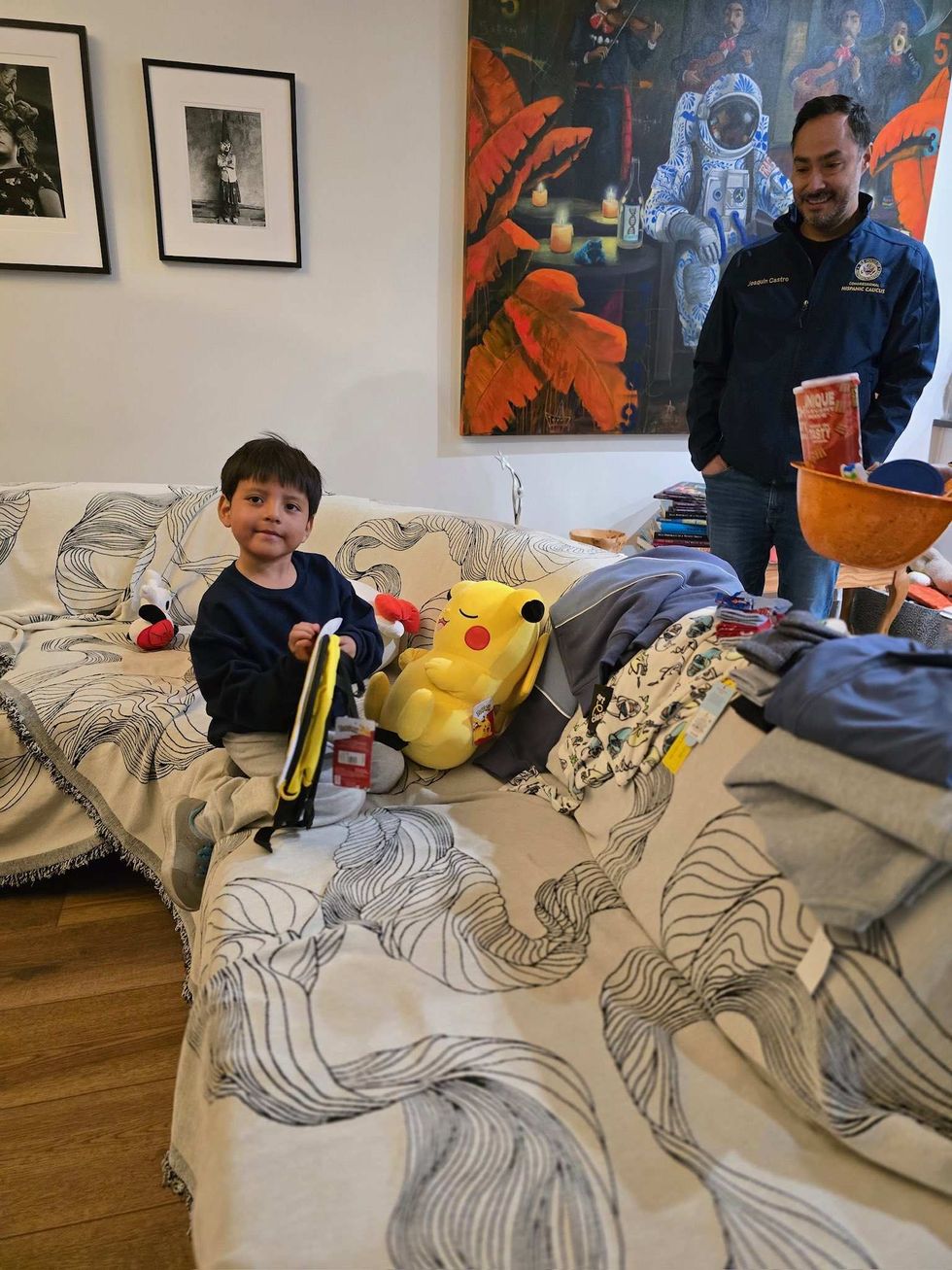Liam Ramos at home with his father