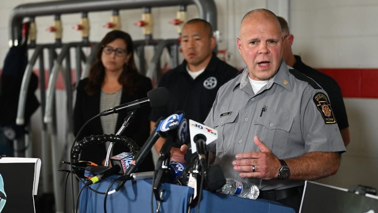 Lietuenant Colonel George Bivans of Pennsylvania State Police holding a press conference