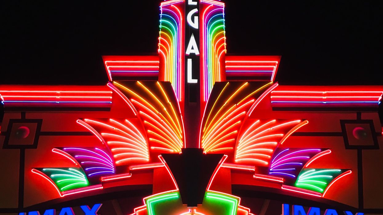 Lit up movie theater at night time