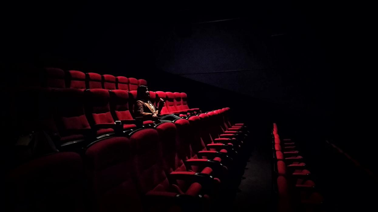 Lone moviegoer in a theater