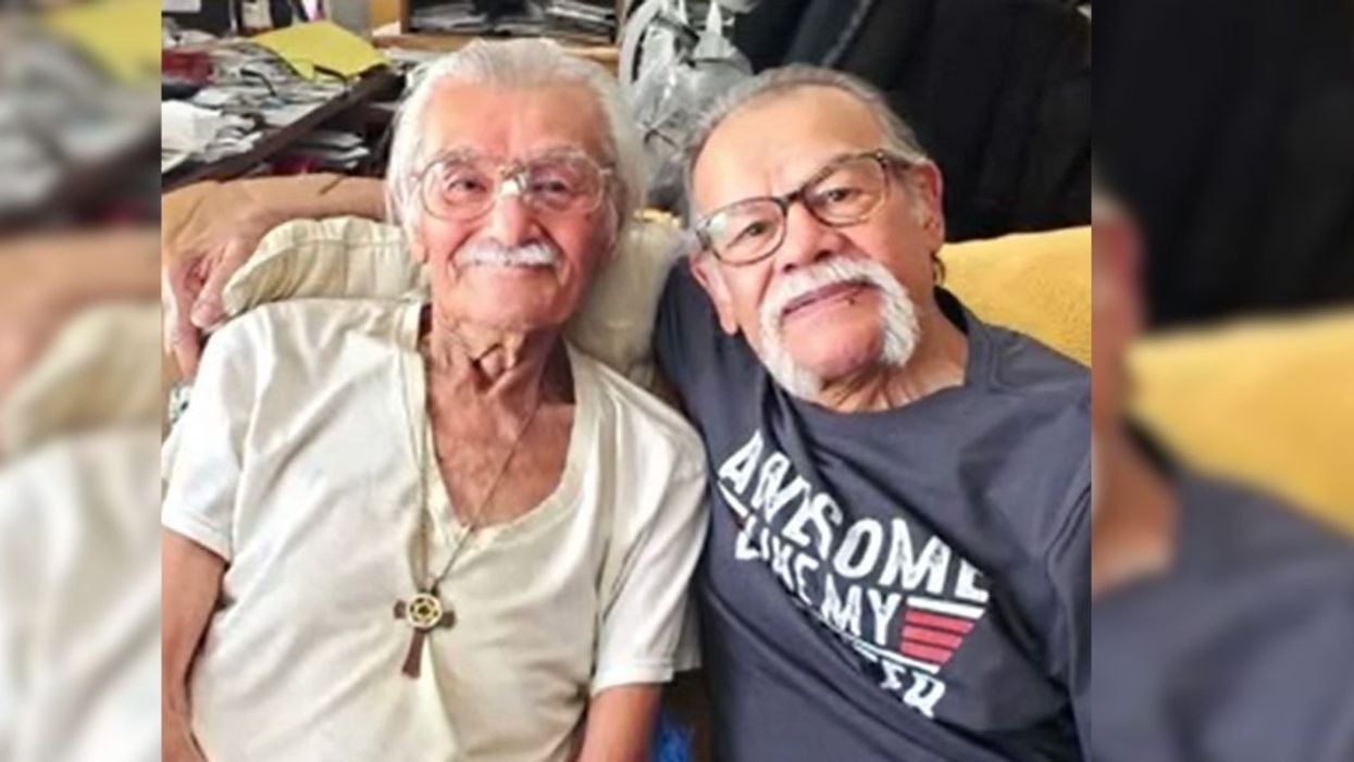 Luis Armando Albino (R) with his late brother Roger (L)