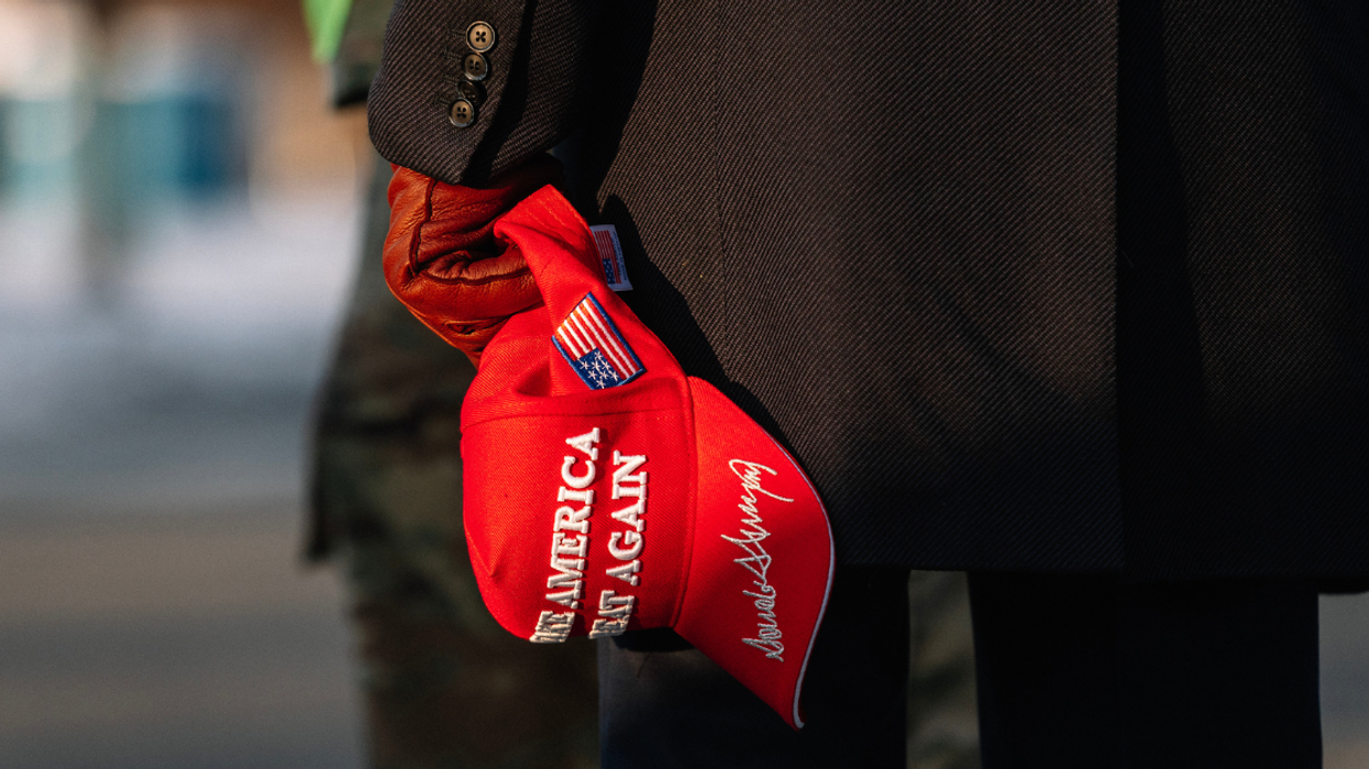 MAGA minion holding red hat