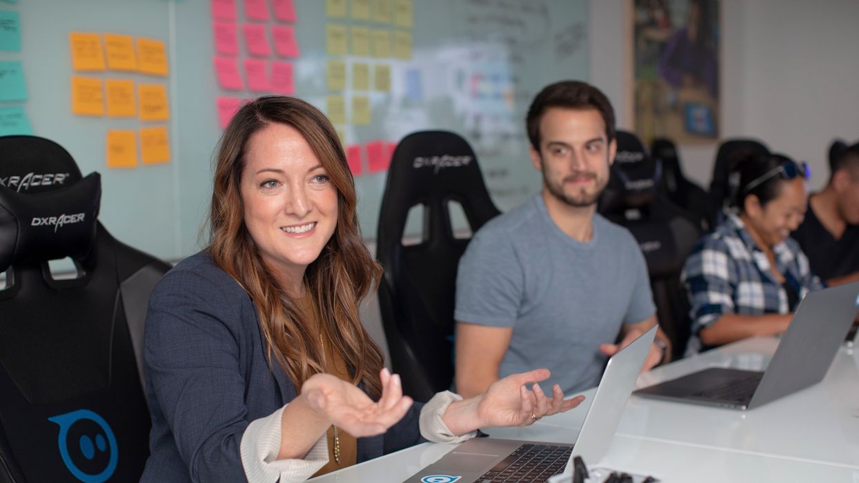 Male coworker looking at female coworker while she talks