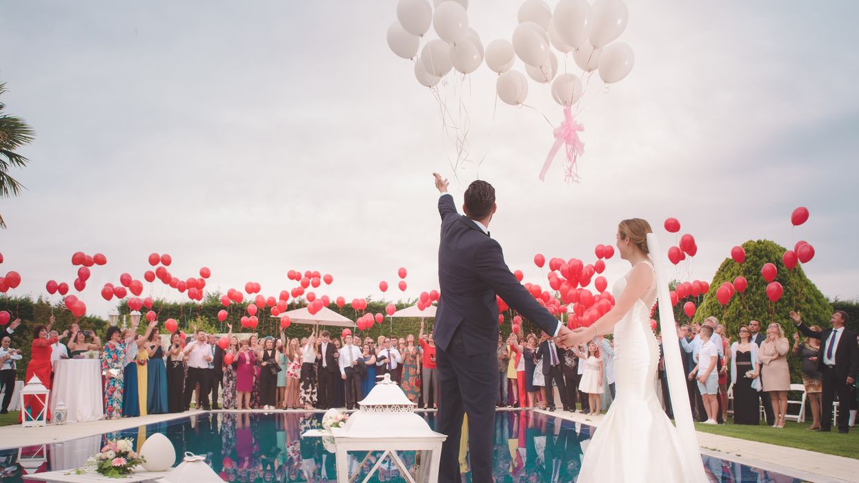 man and woman at wedding with balloons