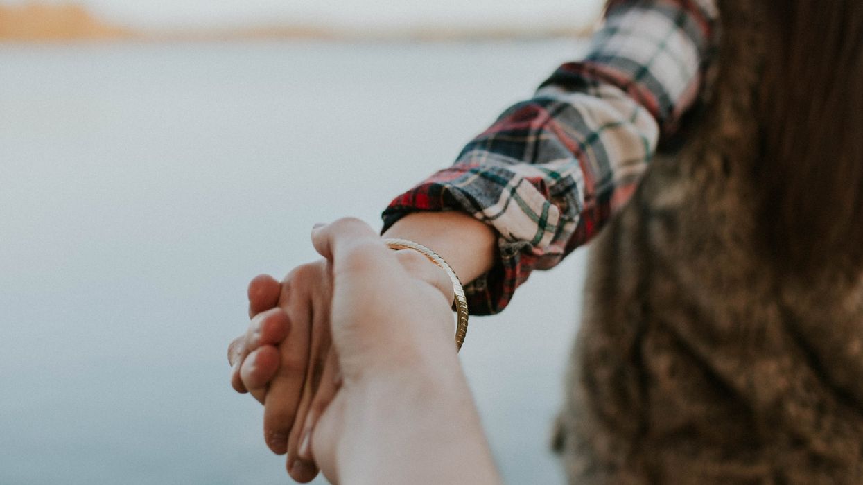 man and woman holding hands