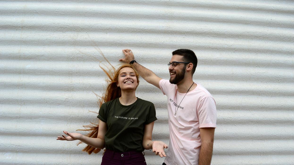 Man and woman laughing
