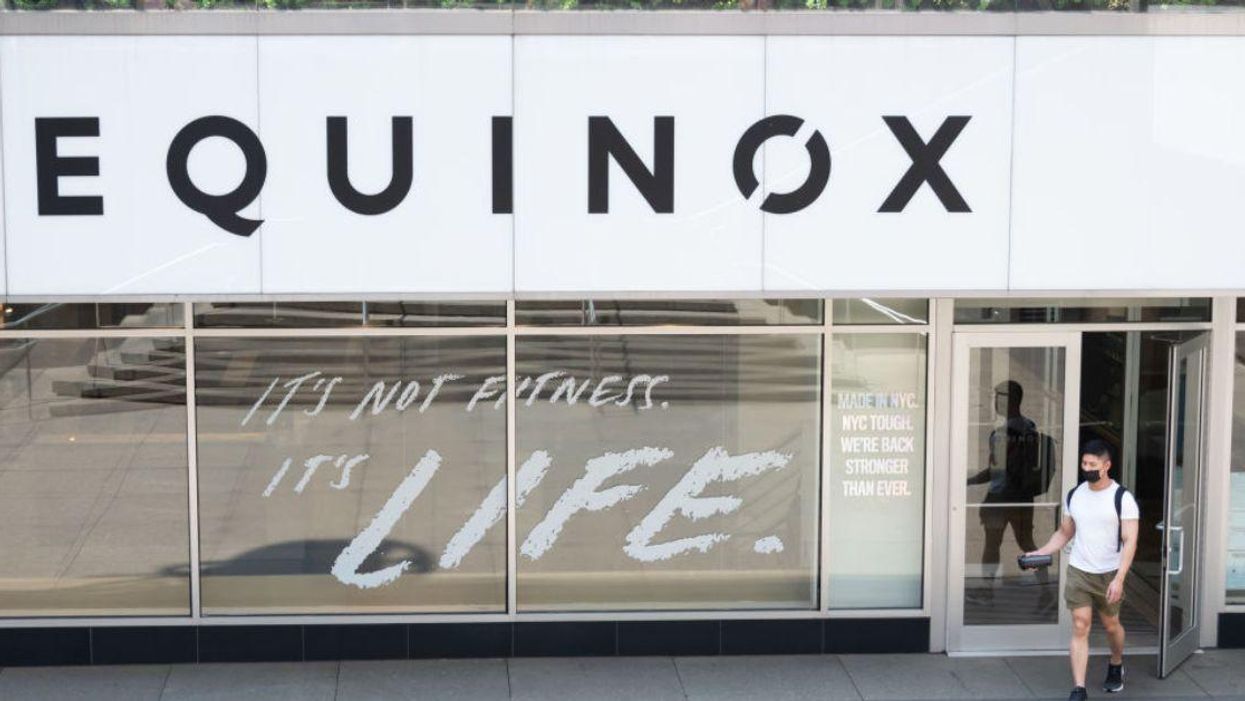 Man exiting Equinox location