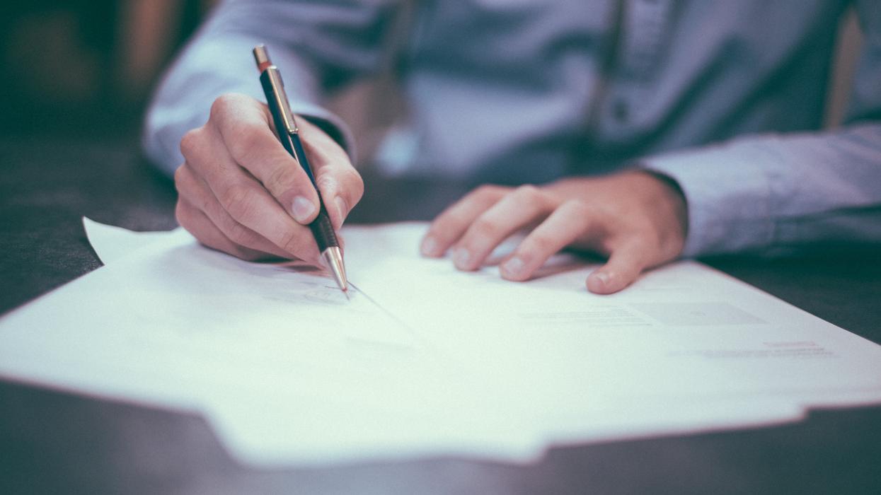 Man filling out paperwork