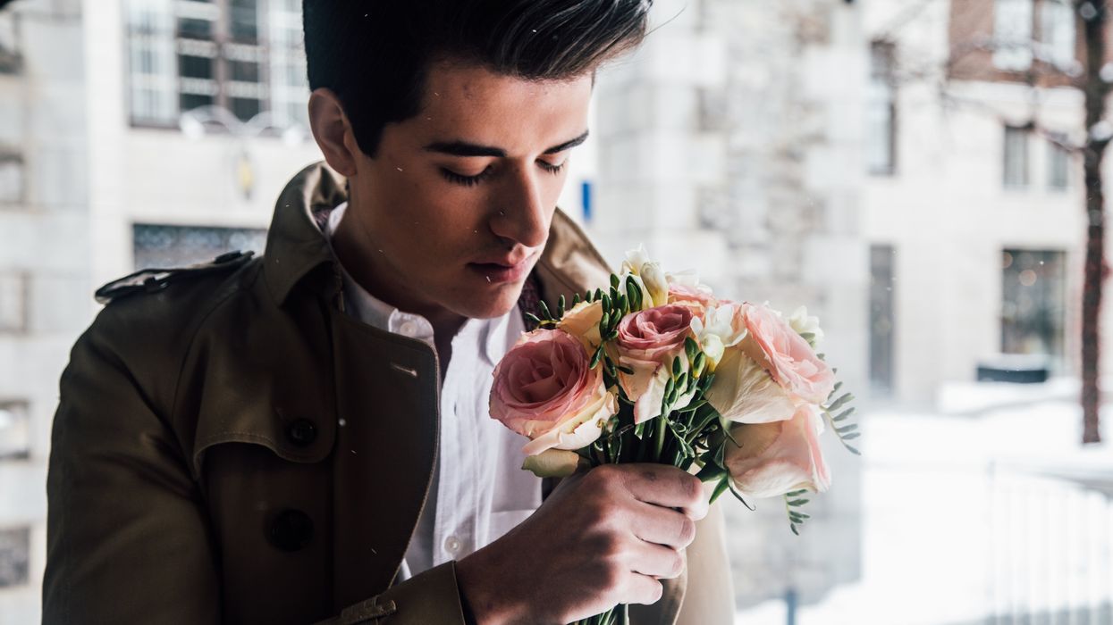 Man holding a bouquet of roses