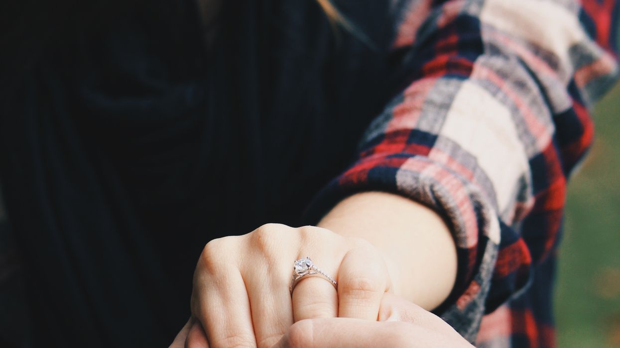 Man holding onto partner's hand