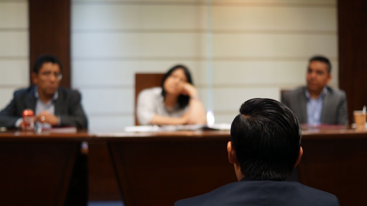 man in black shirt sitting beside woman in white shirt