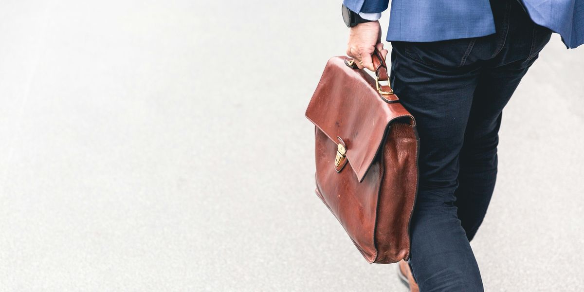 Man leaving with briefcase in hand