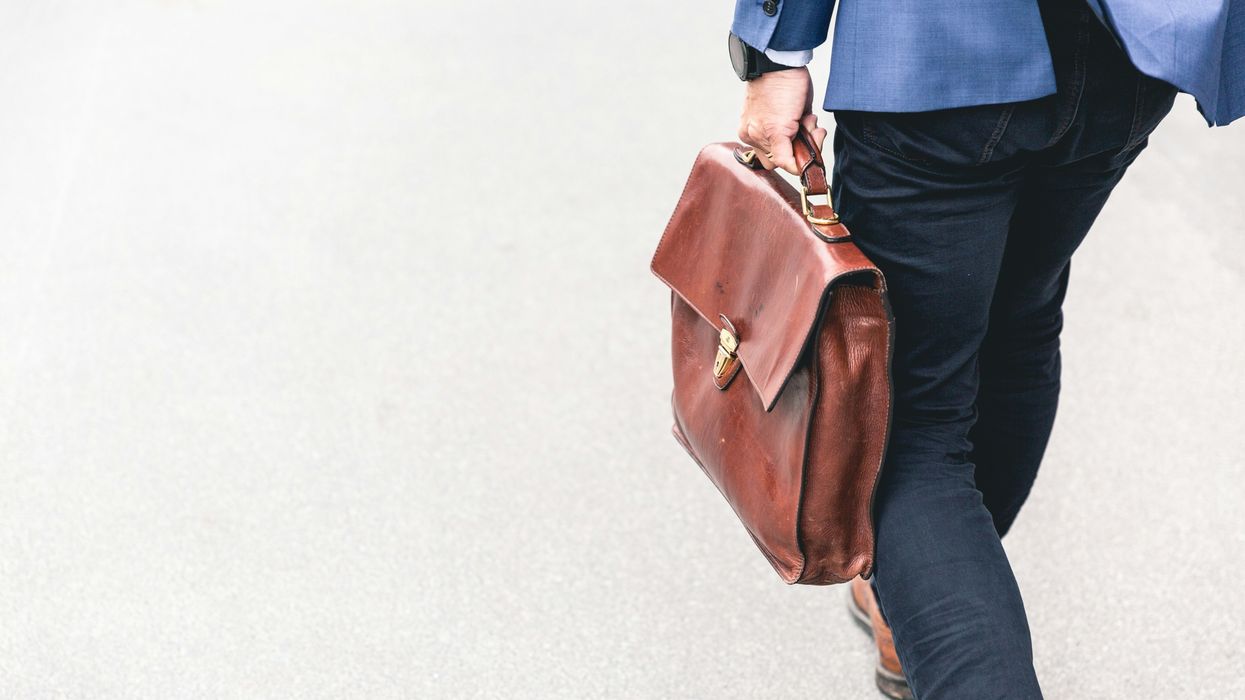 Man leaving with briefcase in hand