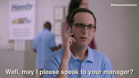 man on cellphone asking to speak to manager GIF