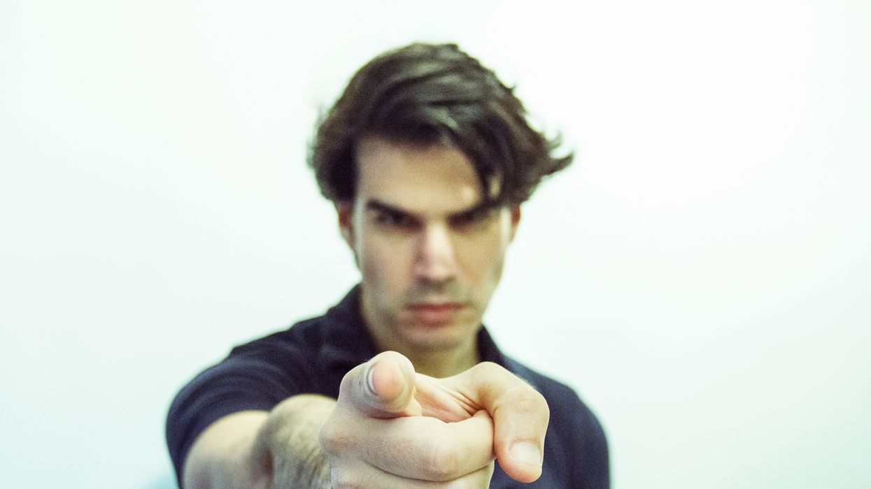 man pointing at camera