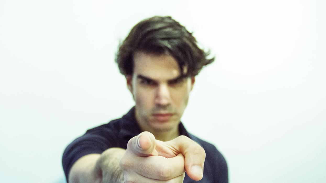 man pointing at camera