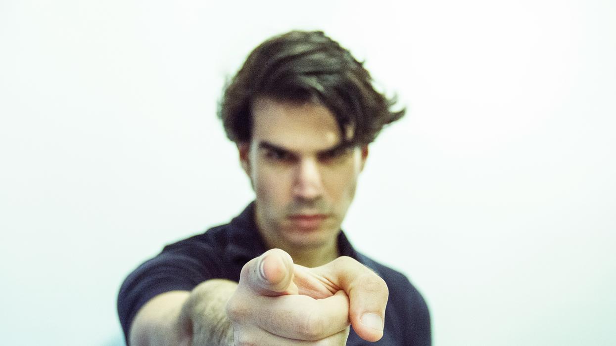 man pointing at camera